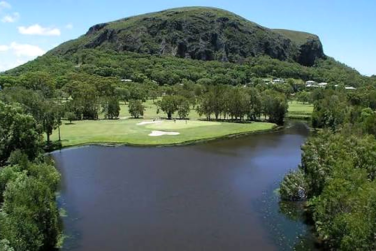 Mount Coolum Golf Club beside a river with volcanic mountain backdrop