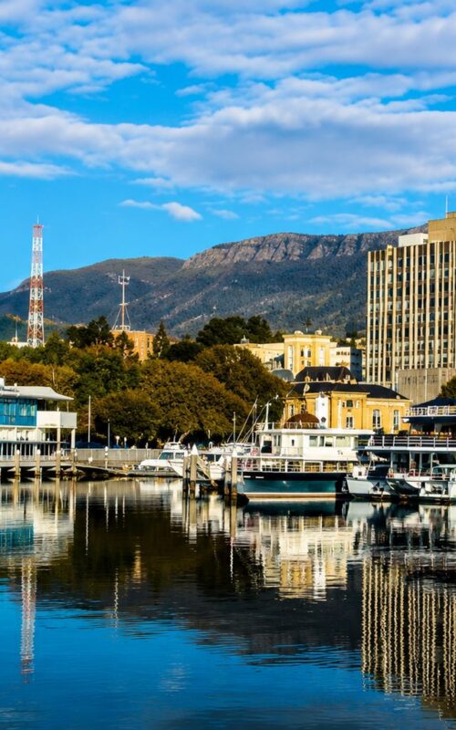 Hobart waterfront with Mount Wellington backdrop on sunny day