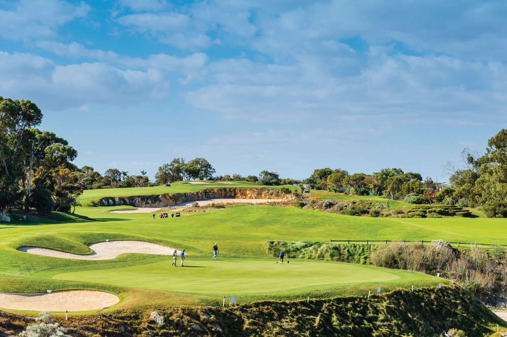 Golfers playing on the scenic Joondalup Golf course with sand bunkers. Play with Golfing Getaways.