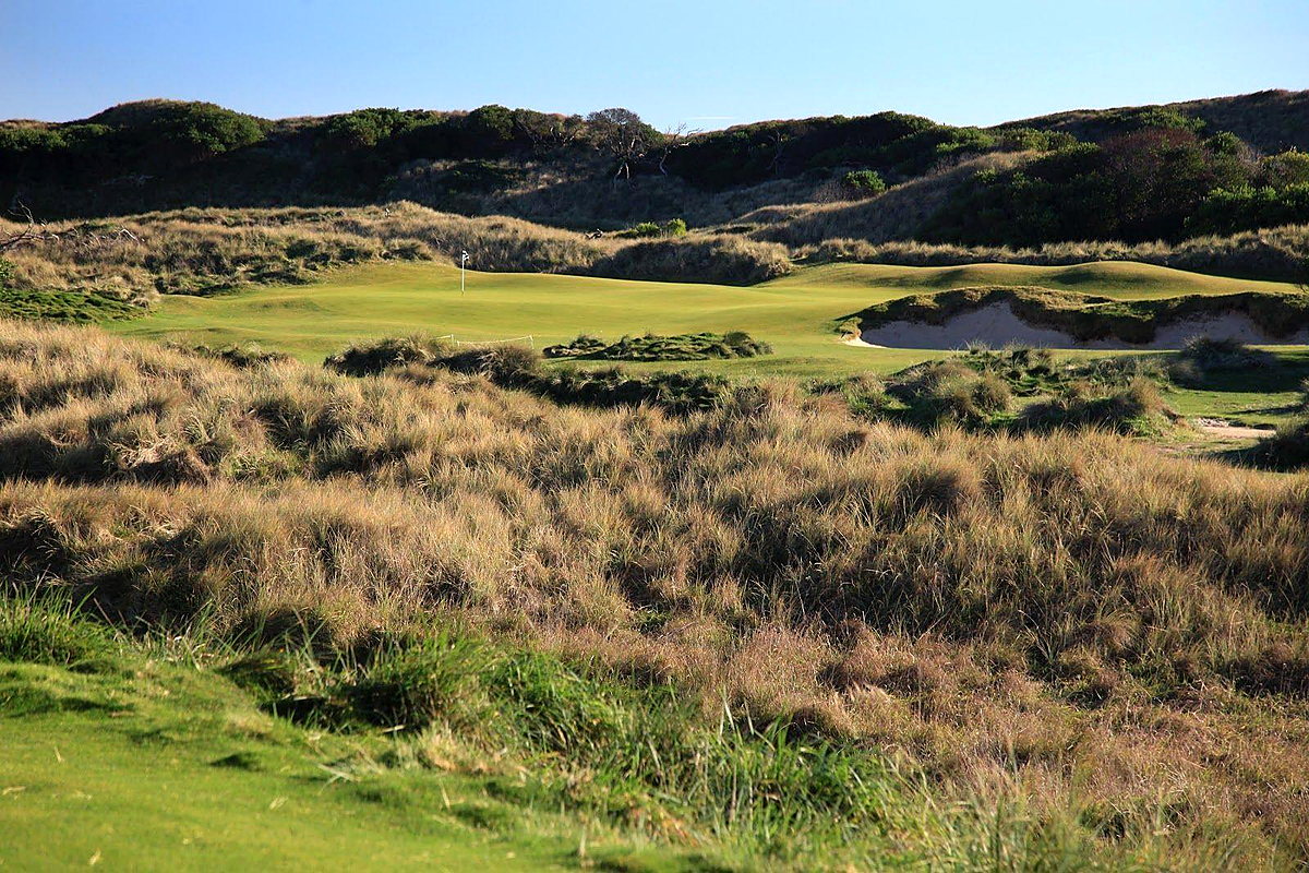 Barnbougle Dunes Links golf course green surrounded by coastal dunes and scrub