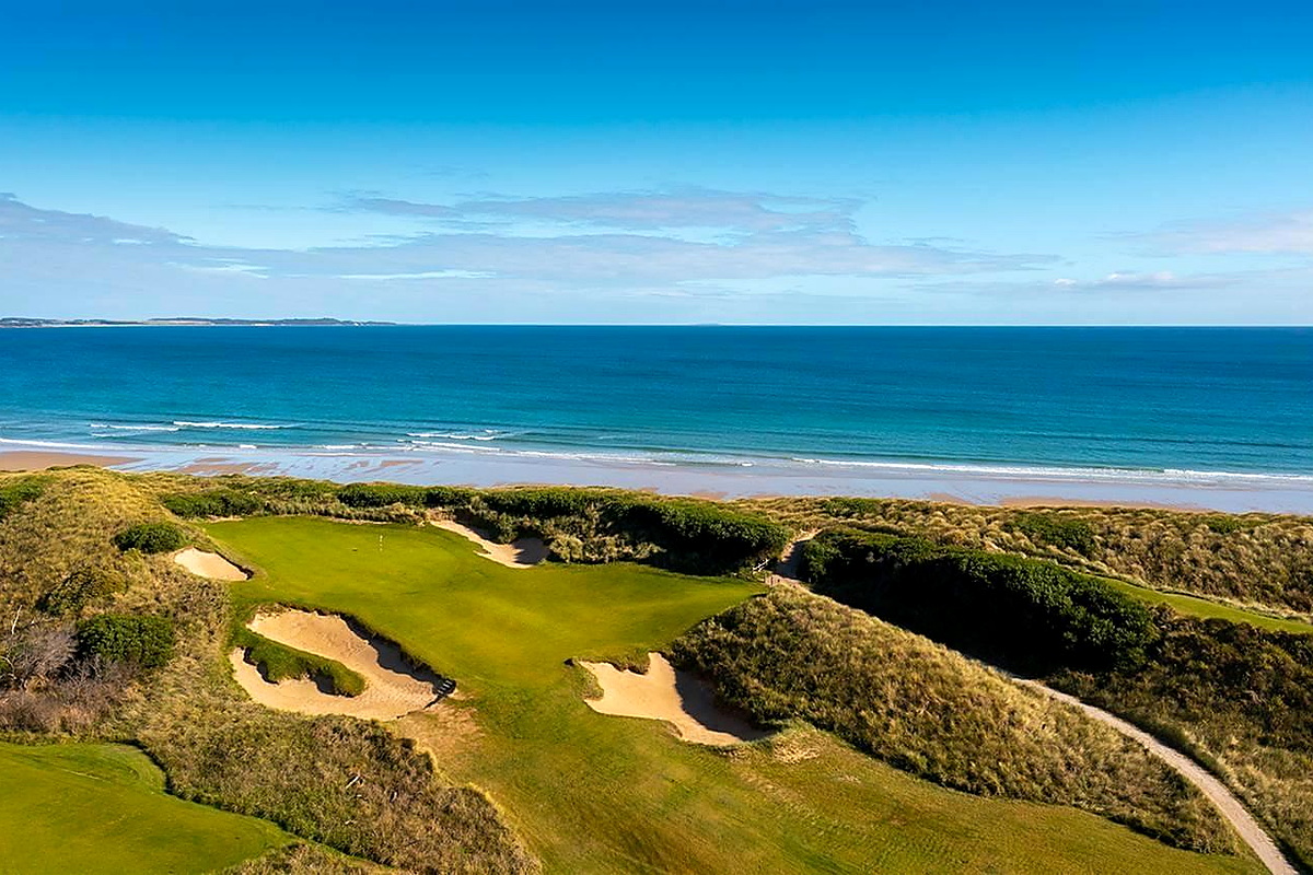 Coastal Barnbougle Dunes links golf course with sand bunkers beside ocean