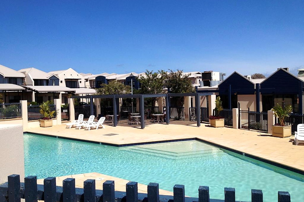 Outdoor pool area at Australian holiday resort on sunny day