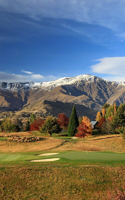 Millbrook Golf Club, Remarkables Course with snow-capped mountains and autumn foliage New Zealand