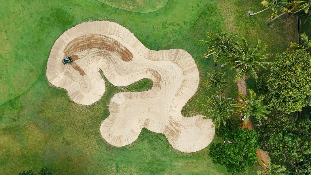 Aerial view of large sand bunker at Batam Island Country Club