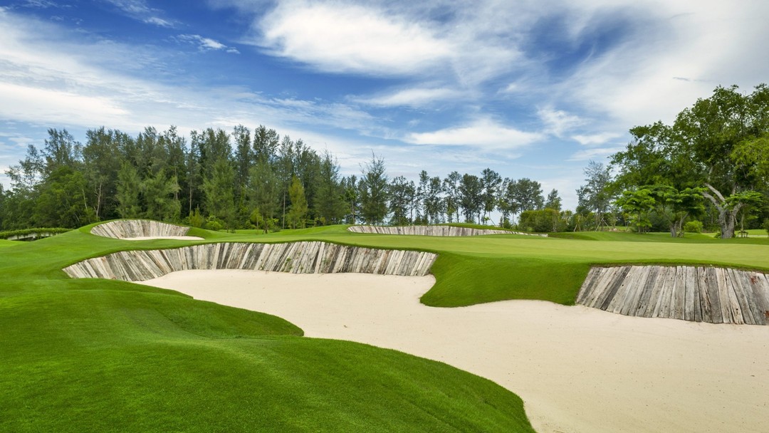 Scenic Aquella Golf Resort & Country Club with sand bunkers and lush green fairways