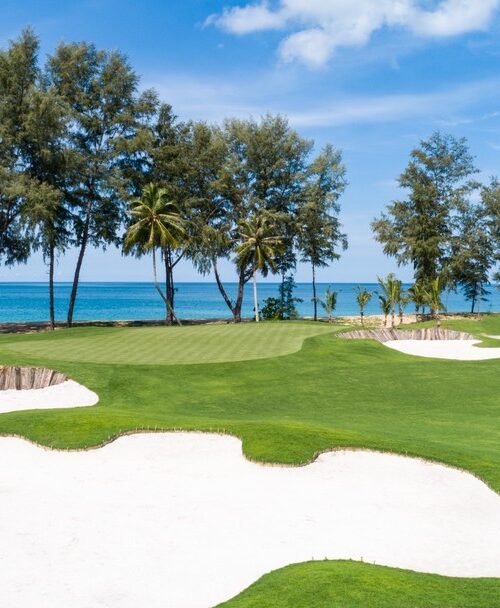 Aquella Golf Resort & Country Club beachside golf course with sand bunkers and ocean views