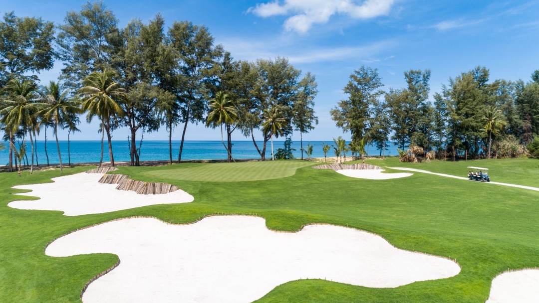 Aquella Golf Resort & Country Club beachside golf course with sand bunkers and ocean views
