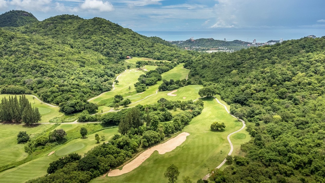 Aerial view of lush Pineapple Valley Golf Club Hua Hin nestled among green hills