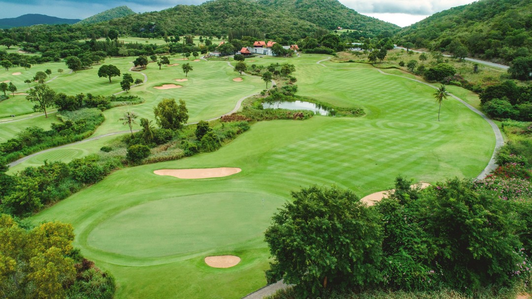 Aerial view of lush tropical Pineapple Valley Golf Club Hua Hin with sand bunkers