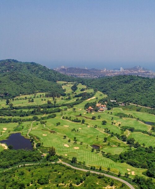 Aerial view of lush Pineapple Valley Golf Club Hua Hin nestled among green hills