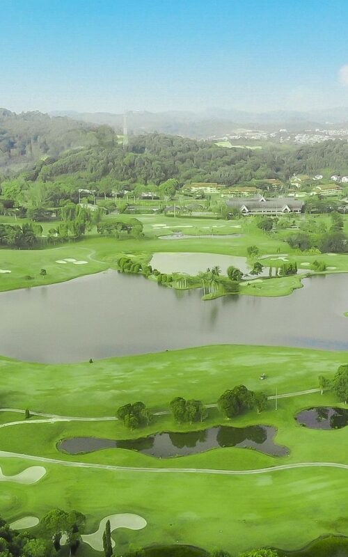 Aerial view of lush green Batam Island Country Club with lakes