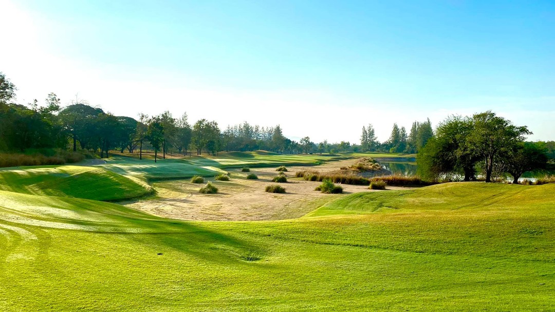 Scenic Springfield Royal Country Club with sand bunkers, water hazard and trees
