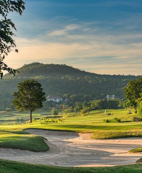 Scenic Springfield Royal Country Club golf course with sand bunkers and mountain backdrop