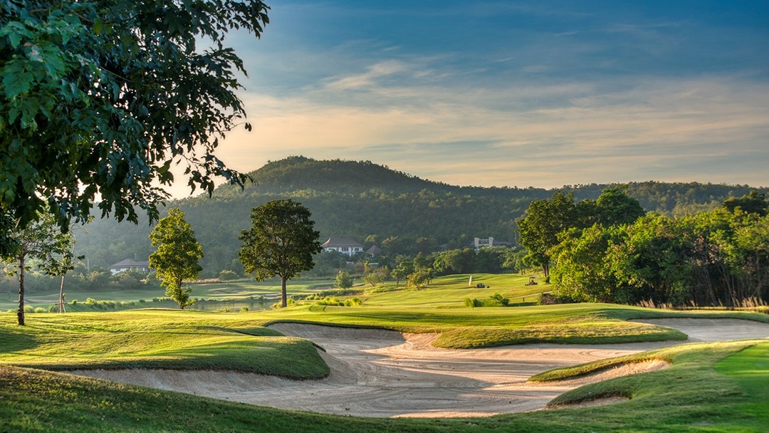 Scenic Springfield Royal Country Club golf course with sand bunkers and mountain backdrop