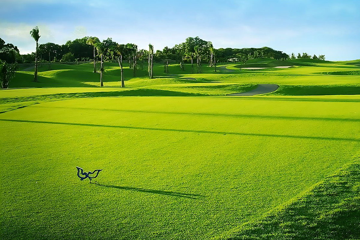 Lush tropical Twin Doves Golf Club with rolling green fairways and palms